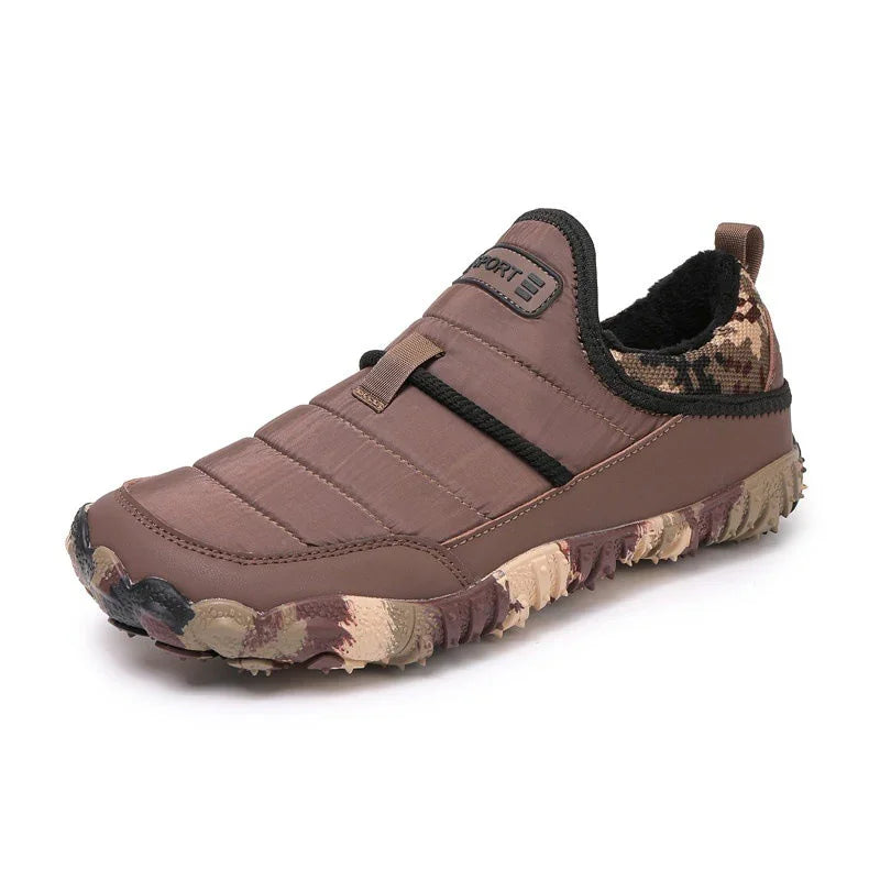 Brown slip-on outdoor sneaker with camouflage heel and rugged sole on white background