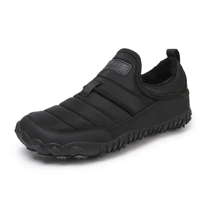 Black slip-on quilted sneaker with rugged sole, suitable for outdoor casual wear
